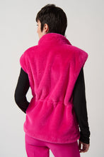 Load image into Gallery viewer, Fully lined with pockets and an adjustable elastic waistband, this faux-fur vest will add a layer of warmth to any outfit with a touch of sophistication. Whether you style it over a button-down or pair it with your go-to knit dress, you&#39;re sure to exude confidence and charm in any setting.   Color-Shocking pink. Faux fur. Mock neck. Sleeveless. Front closure with snaps. Lined.
