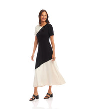 Load image into Gallery viewer, Woman wearing a black and white dress on a white background.
