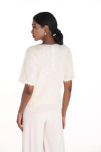 Load image into Gallery viewer, Woman wearing a textured off-white top and off-white pants against a white background.
