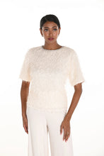 Load image into Gallery viewer, Woman wearing a textured off-white top and off-white pants against a white background.
