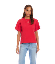 Load image into Gallery viewer, Woman wearing a red short sleeve top and light blue jeans on a white background.
