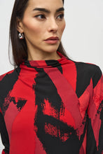 Load image into Gallery viewer, Upgrade your outfit with our silky knit top featuring a vibrant abstract print, long sleeves, and a flattering mock neck. The eye-catching color combination of black and shades of red will surely draw attention.
