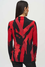 Load image into Gallery viewer, Upgrade your outfit with our silky knit top featuring a vibrant abstract print, long sleeves, and a flattering mock neck. The eye-catching color combination of black and shades of red will surely draw attention.
