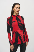 Load image into Gallery viewer, Upgrade your outfit with our silky knit top featuring a vibrant abstract print, long sleeves, and a flattering mock neck. The eye-catching color combination of black and shades of red will surely draw attention.
