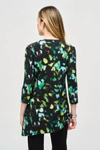 Load image into Gallery viewer, Elegance and comfort blend harmoniously in this beautiful silky knit tunic. Boasting a bold abstract print, the garment is tailored with chic three-quarter sleeves and an airy asymmetrical silhouette that creates an alluring look. The V-shaped neckline with zipper closure infuses modern flair into this classic design.
