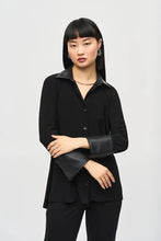 Load image into Gallery viewer, This elegant silky knit blouse features a high-low hem with chic leatherette faux collar stands and cuffs. The flattering fit-and-flare silhouette accentuates your figure while providing exceptional comfort.
