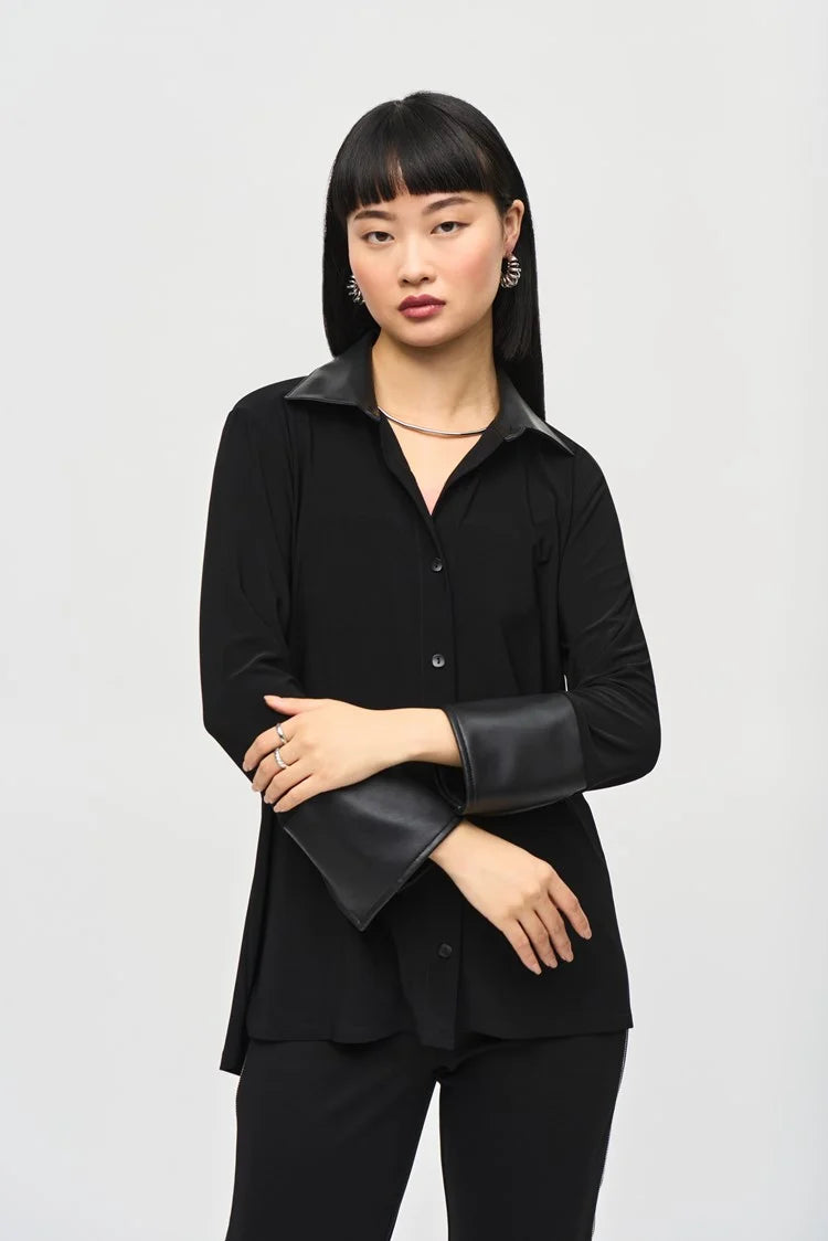 This elegant silky knit blouse features a high-low hem with chic leatherette faux collar stands and cuffs. The flattering fit-and-flare silhouette accentuates your figure while providing exceptional comfort.