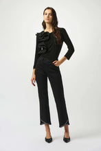 Load image into Gallery viewer, Woman wearing a black ruffled top, black pants and black heels against a white background.
