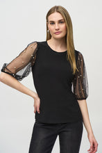 Load image into Gallery viewer, This sleek, fitted knit top is given a romantic flair with puff mesh sleeves adorned with delicate pearls. It&#39;s the perfect choice for an enchanting date night or a glamorous occasion.
