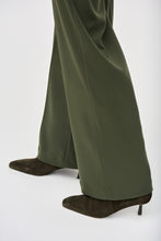 Load image into Gallery viewer, Fabulous and sleek, this high-rise wide leg pant in a gorgeous green will instantly elevate your outfit. The Hensley boasts a flattering high-rise waistline, is fitted through the thigh and flares out to create that ultra-flattering wide leg effect.
