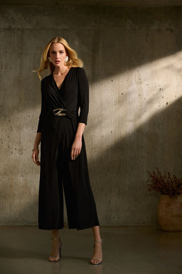 Boost your confidence in every stride with this stunning silky knit wrap jumpsuit. Designed with an overlapping culotte leg and elegant three-quarter sleeves, this garment exudes feminine grace and sophistication. Accentuate your figure with the waistline sash and sleek wrap neckline, while the delicate waist ornament adds a touch of unique charm.