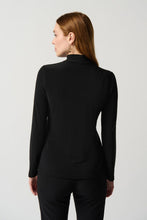 Load image into Gallery viewer, Lightweight and soft on the skin, this figure-flattering top is perfect for pairing with everything in your closet. Featuring long sleeves, a chic mock neck and crystal appliqué, this top provides luxurious comfort while offering an iconic silhouette and French flair.  Color- Black. Silky knit fabric. Mock neck Long sleeves. Crystal appliqué at the front. Unlined. Fabric - 96% Polyester. 4% Spandex.
