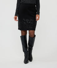 Load image into Gallery viewer, The EsQualo Senia Skirt in black features a beautifully detailed beaded hemline and a convenient zipper closure on the back, making it a necessary addition to any wardrobe. Its timeless design exudes sophistication and can be paired effortlessly with our matching Beate Blazer with Sleeve Embellishments - EsQualo W2405719 or elegant blouse for a polished look.
