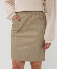Load image into Gallery viewer, Model wearing a taupe skirt, beige sweater and knee-high cream boots against a white background.
