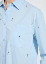Load image into Gallery viewer, Close-up of light blue blouse with crystal embellishments against a white background.
