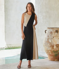 Load image into Gallery viewer, This fabulous dress is meant to be in your spring/summer wardrobe! Contrasting panels give this figure-flattering dress an edgy, modern look. It also features a trend-right midi length. Colors- Beige and black. Sleeveless. Colorblock. Center back invisible zipper. Midi length.

