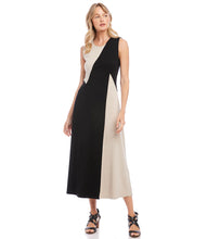 Load image into Gallery viewer, This fabulous dress is meant to be in your spring/summer wardrobe! Contrasting panels give this figure-flattering dress an edgy, modern look. It also features a trend-right midi length. Colors- Beige and black. Sleeveless. Colorblock. Center back invisible zipper. Midi length.
