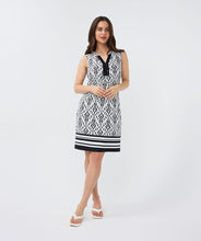 Load image into Gallery viewer, This bestselling EsQualo dress features a chic two-tone Ikat print in classic black and white, making it perfect for a variety of occasions. The beads on the neckline provide a polished finishing touch.
