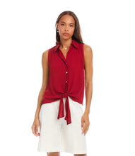 Load image into Gallery viewer, Woman wearing a red sleeveless blouse with a tie front and white shorts on a white background.
