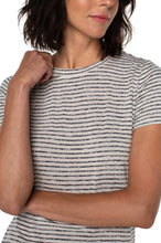 Load image into Gallery viewer, Woman wearing a tan and black stripe short sleeve top against a white background.
