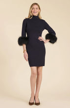 Load image into Gallery viewer, This season, elevate your special occasion wardrobe with the Sloane Fur Trimmed Knit Dress in Black by Tyler Boe. Enhanced with sophistication and glamour, this dress features a chic mock neck and luxurious fur cuffs. Make a statement and stand-out in a crowd with this stunning piece.
