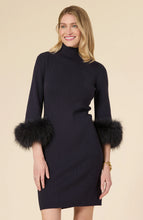 Load image into Gallery viewer, This season, elevate your special occasion wardrobe with the Sloane Fur Trimmed Knit Dress in Black by Tyler Boe. Enhanced with sophistication and glamour, this dress features a chic mock neck and luxurious fur cuffs. Make a statement and stand-out in a crowd with this stunning piece.
