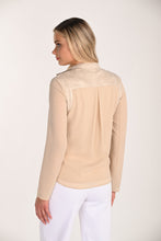 Load image into Gallery viewer, Woman wearing a beige jacket and white pants on a plain background.
