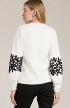 Load image into Gallery viewer, Elevate your favorite cozy sweater with stylish soutache appliqués, transforming a wardrobe staple into something special. This versatile piece pairs perfectly with everything from ballet flats to boots and jeans. Ideal for any occasion, this sweater is a must-have addition to your collection.
