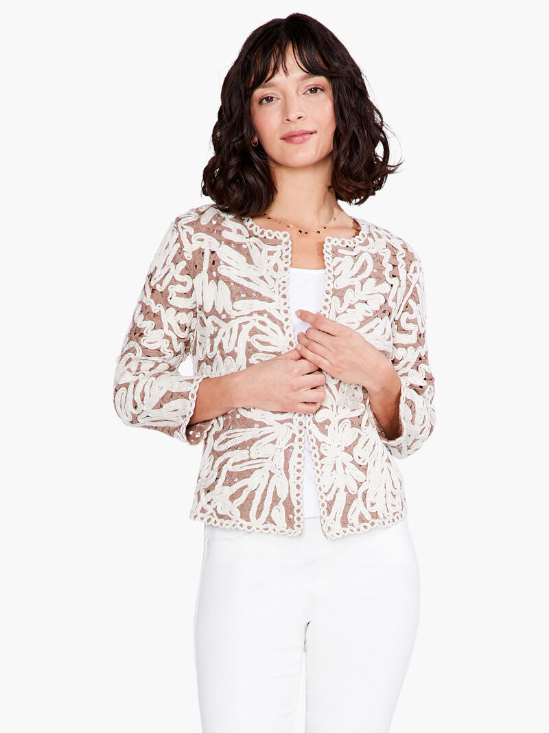 Perfectly stunning describes this fashionable jacket that will set you apart in a crowd. The style is made extra special with metallic lurex fiber incorporated right into the soutache that gives it a bit of shine. A timeless style that can worn for special occasions but also makes a bold statement when worn casually paired with denim.