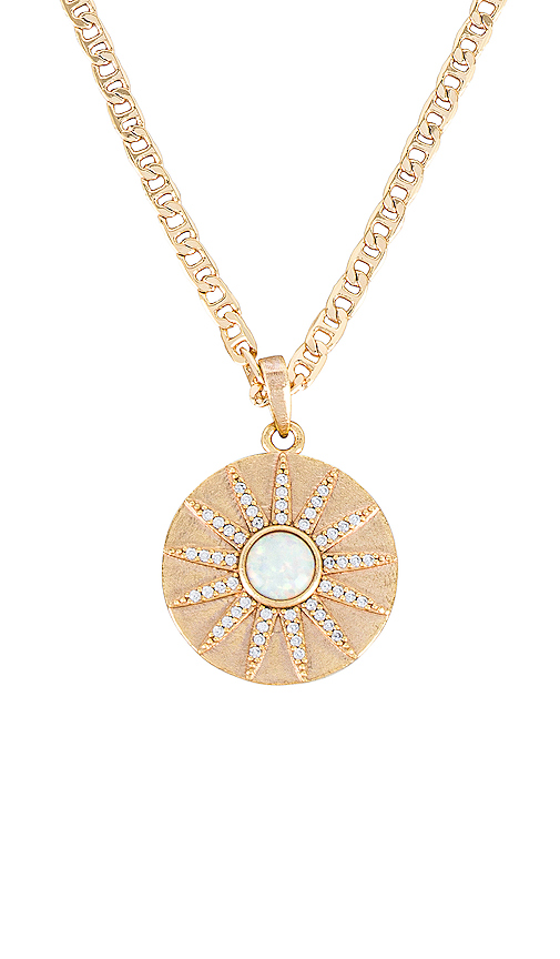 A brilliant necklace made for a goddess.  The Stargazer Necklace features a shimmering gold sunburst pendant with a fiery opal center surrounded by sparkling CZs. This piece was made to reflect the light and be seen!  Colors- Gold, white and clear. Opal Stone with Cubic Zirconia. 14K gold plate over brass. 20mm charm diameter. 18