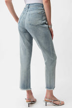Load image into Gallery viewer, Light blue crop jeans and silver heels worn by a model on a white background.
