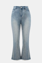Load image into Gallery viewer, Light blue jeans with sequin detailing on a white background.
