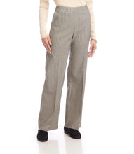 Load image into Gallery viewer, Model wearing black and cream checkered pants, cream top and black loafers against a white background.
