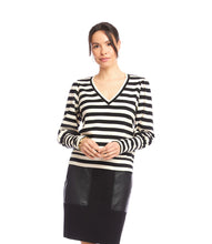 Load image into Gallery viewer, Woman wearing a black and cream striped top with a black leather skirt  against a white background.
