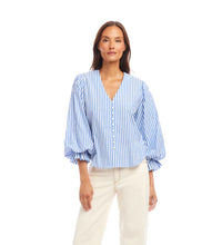 Load image into Gallery viewer, Woman wearing a blue and white striped blouse against a white background.
