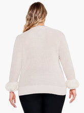 Load image into Gallery viewer, Bring a twist to your classic sweater with this statement-making fringe detail. The body has been knitted with a shaker stitch for a soft and comfortable feel. The pleats at the shoulder result in an effortless, feminine shape. This stunning style falls at the hips with ease.  Color- Canva. Pullover sweater. Pleated sleeve with fringe cuff. Midweight. Regular fit. Crewneck. Bracelet sleeve.
