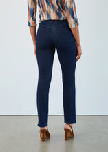 Load image into Gallery viewer, Woman wearing a patterned blouse, blue jeans and brown heels against a white background.
