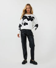 Load image into Gallery viewer, Receive compliments when you style this gorgeous EsQualo sweater with 3D flowers in a classic black and off-white color. Crafted from a blend of viscose, nylon, and polyester, this sweater not only offers a luxurious feel but also ensures durability and breathability. The intricate 3D flower embellishments add a unique touch, making it a standout piece in any wardrobe. Perfect for layering over jeans or pairing with a skirt for a sophisticated look.
