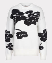 Load image into Gallery viewer, Receive compliments when you style this gorgeous EsQualo sweater with 3D flowers in a classic black and off-white color. Crafted from a blend of viscose, nylon, and polyester, this sweater not only offers a luxurious feel but also ensures durability and breathability. The intricate 3D flower embellishments add a unique touch, making it a standout piece in any wardrobe. Perfect for layering over jeans or pairing with a skirt for a sophisticated look.
