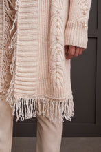 Load image into Gallery viewer, Envelop yourself in elegance with the Senara Sweater Cardigan. This cozy knitted cardigan boasts distinctive descending pearl embellishments along the sleeves and a frilled collar, making it an ideal addition to elevate any outfit.
