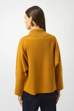 Load image into Gallery viewer, Woman wearing a mustard yellow long-sleeve top and navy pants against a white background.
