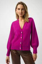 Load image into Gallery viewer, Woman wearing a purple cardigan with rhinestone buttons and brown faux leather pants against a white background.
