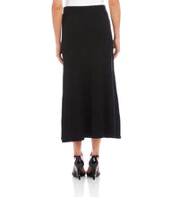Load image into Gallery viewer, Long black skirt and black sandals worn by a model against a white background.

