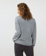 Load image into Gallery viewer, This chic sweater boasts a stylish grey color and is adorned with dazzling rhinestones on the bottom and sleeves, making it a standout piece. Its oversized fit pairs effortlessly with faux leather pants for an edgy, yet sophisticated look, or can be paired seamlessly with denim for a more polished casual style.
