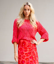 Load image into Gallery viewer, Crafted with intricate openwork details, this lightweight sweater is the perfect addition to any wardrobe. Its vivid, cheery color and classic round neckline make it a versatile piece that pairs well with white pants, shorts, or your favorite jeans. This gorgeous sweater offers both style and comfort.
