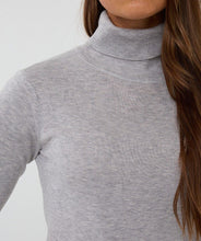 Load image into Gallery viewer, Grey turtleneck sweater worn by a model against a neutral background.
