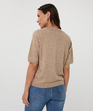 Load image into Gallery viewer, Woman wearing a taupe sweater and blue jeans against a plain background.
