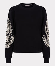 Load image into Gallery viewer, Our Sanne sweater is a work of art and a masterpiece of comfort and style. This black sweater features elegant puff sleeves and intricate cream stitching details. Crafted with anti-pilling acrylic, it promises durability and superior quality. 
