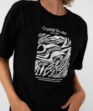 Load image into Gallery viewer, Black t-shirt with white graphic design and 'Crystal Studio' text against a plain background.
