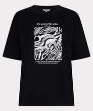 Load image into Gallery viewer, Black t-shirt with white graphic design and text Cystal Studio against on a light gray background.
